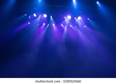 scene, stage light with colored spotlights and smoke - Shutterstock ID 1030324360