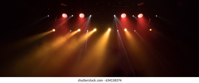 scene, stage light with colored spotlights and smoke - Shutterstock ID 634158374