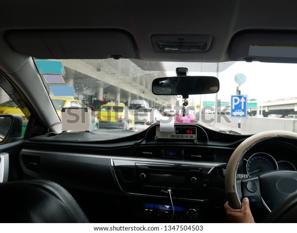 The scene of the view from the taxi\
car with taxi meter display in bangkok, Thailand\
