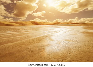 Scene Of Water Landscape In The Dunes Of The Sahara Desert, Tatooine. Tunisia, Africa. Sunset Or Sunrise With Beautifull Clouds.