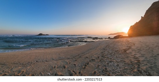 Sceneric view of the sandy beach while sunset in the afternoon