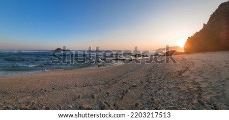 Sceneric view of the sandy beach while sunset in the afternoon