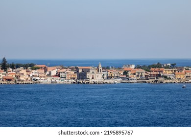 Scenery along the high density shoreline of Messina Italy on the island of Sicily as seen from the water