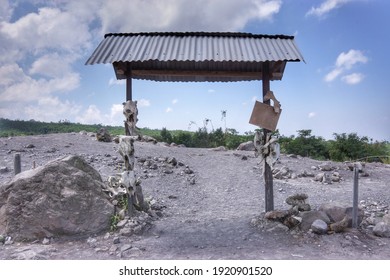 Scenery Of Animal Skulls At Mount Merapi Area In Central Java, Indonesia From Volcano Eruption In 2010 With Clouds In Blue Sky Background. Example Of Natural Disaster. No People. 