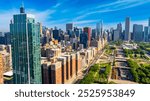 Scenery of beautiful Millennium Park at the lakefront of Chicago, Illinois, United States. Stunning view of green zone in combination with modern architecture. Aerial perspective.