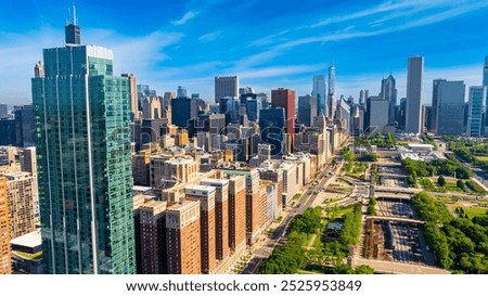 Scenery of beautiful Millennium Park at the lakefront of Chicago, Illinois, United States. Stunning view of green zone in combination with modern architecture. Aerial perspective.