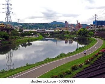 The scenery bicycle path and footpath along the river at Shuangxi Riverside Park, Taipei