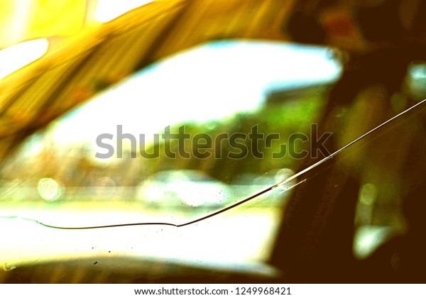 scenery blurry vision of cracked on glass at\
front window of automobil in closeup and minimal style so\
impressive pattern for object\
background