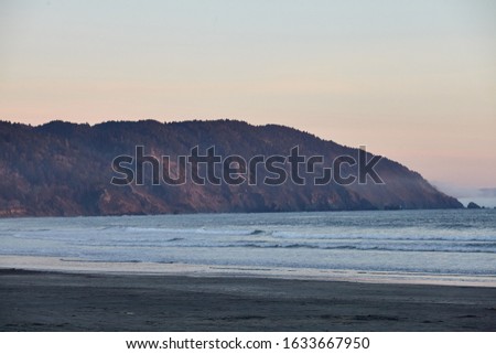 A scenery of a breathtaking sunset over the Pacific Ocean near Eureka, California