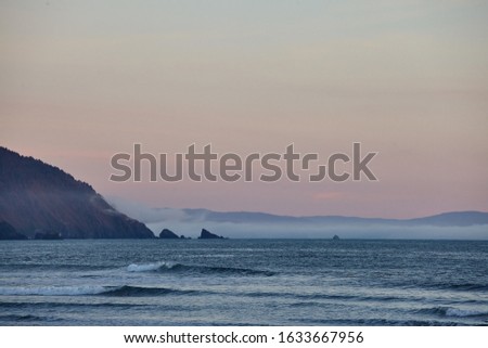 A scenery of a breathtaking sunset over the Pacific Ocean near Eureka, California