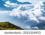 Scenery of foggy morning at Tre Cime di Lavaredo, Drei Zinnen, three distinctive battlement-like peaks, in the Sexten Dolomites of northeastern Italy, one of the best-known mountain groups in the Alps