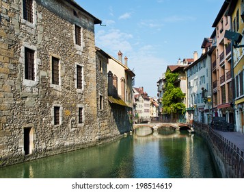 Scenery of fold buildings reflection in Annecy canal.
