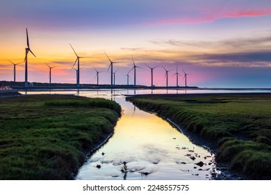 Scenery of Gaomei Wetlands wind turbines during golden hour in Taichung