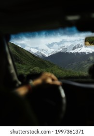 Scenery Moment In The Car. Image Of Man Driving A Car In The Mountain