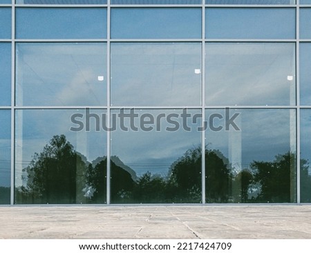 scenery reflection on brand new commercial office building glassy facade