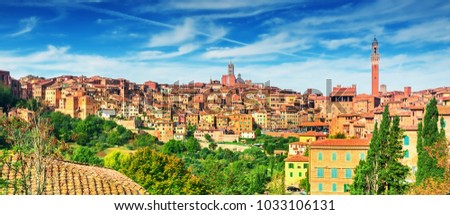 Scenery of Siena, a beautiful medieval town in Tuscany, with view of the Dome & Bell Tower of Siena Cathedral (Duomo di Siena), landmark Mangia Tower and Basilica of San Domenico,Italy