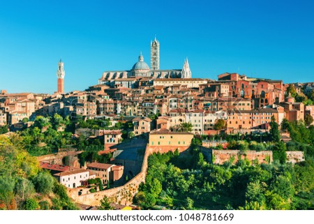 Scenery of Siena, a beautiful medieval town in Tuscany, with view of the Dome & Bell Tower of Siena Cathedral (Duomo di Siena), landmark Mangia Tower and Basilica of San Domenico,Italy