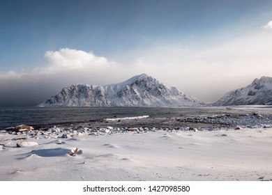 Scenery Of Snow Mountain Range With Overcast Sky In Winter At Skagsanden Beach