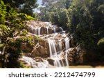 Scenery of Sungai Pandan Water Fall. Long exposure photography of a rainforest water fall. Waterfall in tropical forest at Malaysia. Beautiful waterfall in the forest. Soft water flow.