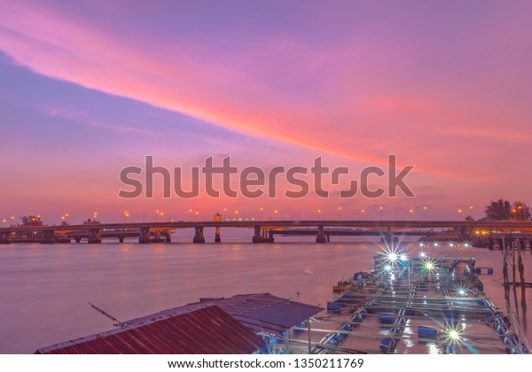scenery sunset at Sarasin bridge. the bridge is the\
most important in making businesses. \
From the provinces to Phuket\
has traded a lot of money. This bridge linking the province of\
Phang Nga.