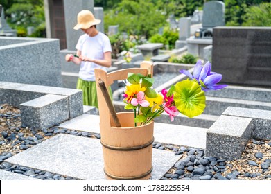 Scenery of visiting a Japanese grave - Shutterstock ID 1788225554