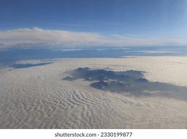 Scenery waves from over the clouds