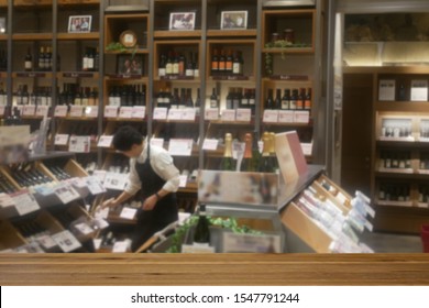 Scenery Of A Wine Shop With A Clerk