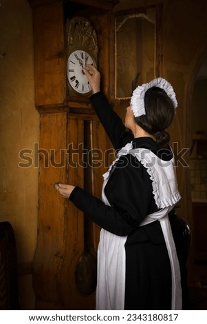 Scenes of a beautiful young Victorian maid doing house chores in an antique interior