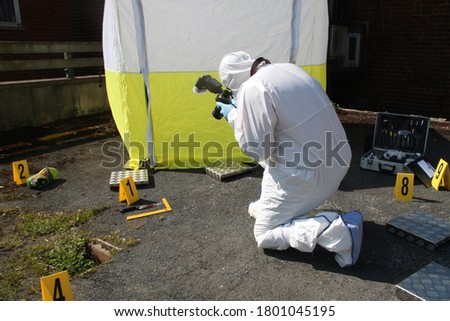 scenes of crime photographer CSI SOCO
photographing crime scene, police crime scene