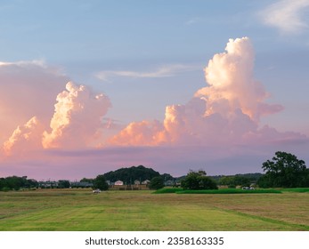 Scenes of Cumulonimbus cloud on the blue sky in the evening, along with villages in Japan rural area . - Powered by Shutterstock