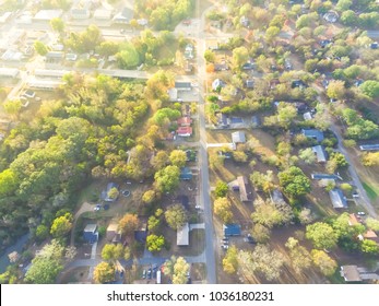 Scenic Aerial Green Suburban Area Of Ozark, Arkansas, USA. Top Overhead Residential Neighborhood Tightly Packed Homes, Driveway Surrounded By Lush Tree Flyover In Autumn Sunset. View From East Side