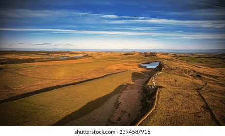 Scenic aerial landscape photo of the nature at Sycamore Gap, UK - Shutterstock ID 2394587915