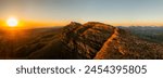 Scenic aerial landscape of WIlpena Pound rock formation range and peaks at sunset in FLinders Ranges of Australia.