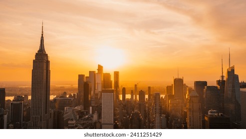 Scenic Aerial New York City Evening View of Lower Manhattan Architecture. Panoramic Downtown Photo from a Helicopter at Sunset. Cityscape with Modern Office Buildings and Historic Skyscrapers - Powered by Shutterstock