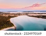 Scenic aerial sunrise lakescape over Swansea channel bridge and town on Pacific coast of Australia at Lake Macquarie.