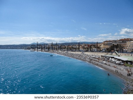 Scenic aerial view of the beach and promenade des Anglais in Nice, Cote d'Azur, Provence, France, Europe. Turquoise water of the French on a sunny summer day. Coastline in the Mediterranean sea
