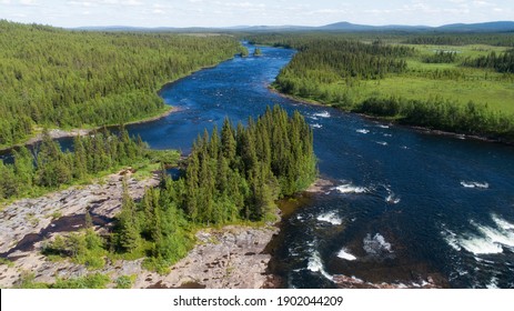 Scenic Aerial View Of A Beautiful Wild River In Swedish Lapland. 