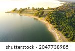 Scenic aerial view northern end of Lake Lavon in Princeton, Texas, America in early morning. Top view Ticky Creek Park with swimming area, sandy shoreline, plenty of trees and picnic areas