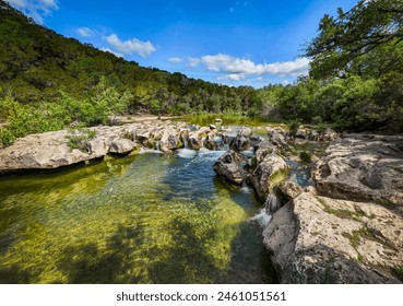 Scenic aerial view of Sculpture Falls via Barton Creek Greenbelt Trail in Austin Texas at summer