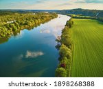Scenic aerial view of the Seine river and green fields in French countryside. Val d