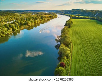 Scenic aerial view of the Seine river and green fields in French countryside. Val d'Oise department, Ile-de-France, Northern France - Powered by Shutterstock