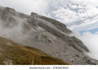 Scenic alpine mountain pass with dramatic cloudscape at Col de la Colombière, Bornes-Aravis massif, Haute-Savoie, French Alps