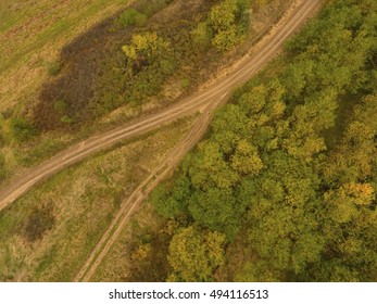 Scenic autumn landscape with country road. Aerial view.