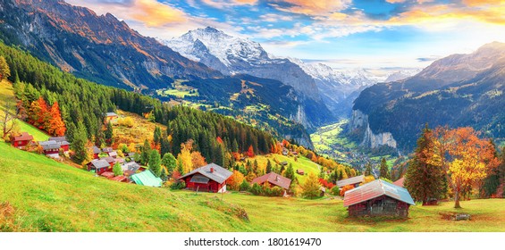 Scenic autumn view of picturesque alpine Wengen village and Lauterbrunnen Valley with Jungfrau Mountain and  on background. Location: Wengen village, Berner Oberland, Switzerland, Europe. - Powered by Shutterstock