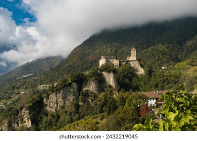 Scenic autumn view of Tyrol Castle (Schloss TirolCastel Tirolo) in Dorf Tirol valley near Merano, in the Burggrafenamt district of South Tyrol, Italy