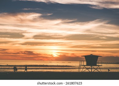 Scenic Beach Sunset In Oceanside, California, USA. Beach With Wooden Lifeguard Tower.