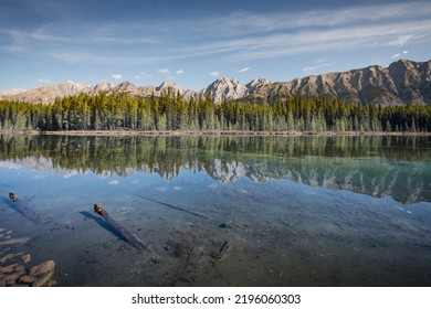 Scenic Calgary Mountains Peaks Reflected In A Pool