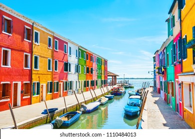 Scenic canal with colorful buildings in Burano island, Venice, Italy - Powered by Shutterstock