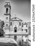 The scenic Chiesa del Carmine, located in the centre of Comacchio, picturesque town with canals and bridges in the province of Ferrara, Italy