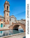 The scenic Chiesa del Carmine, located in the centre of Comacchio, picturesque town with canals and bridges in the province of Ferrara, Italy